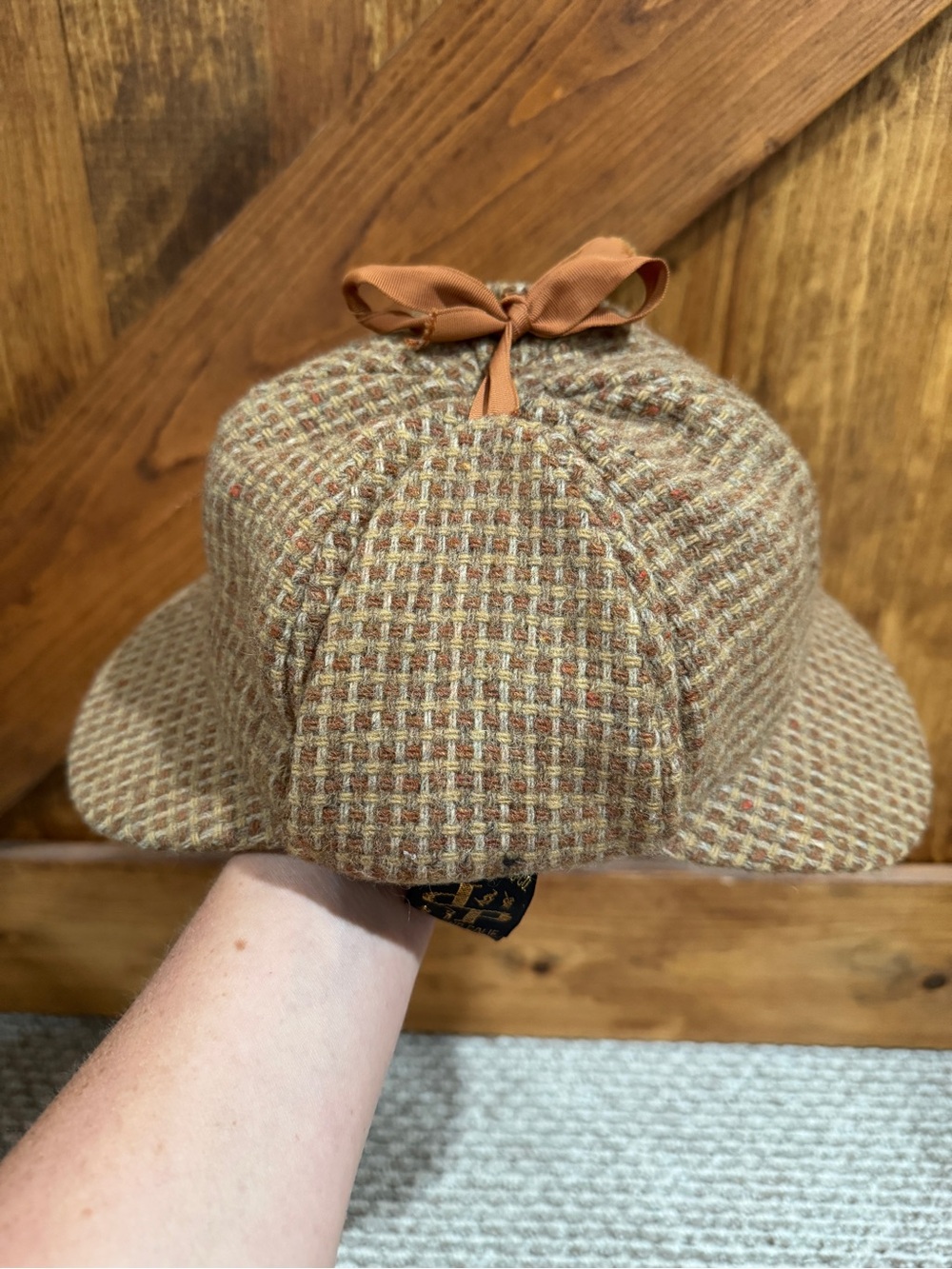 Vintage deerstalker cap with bow.